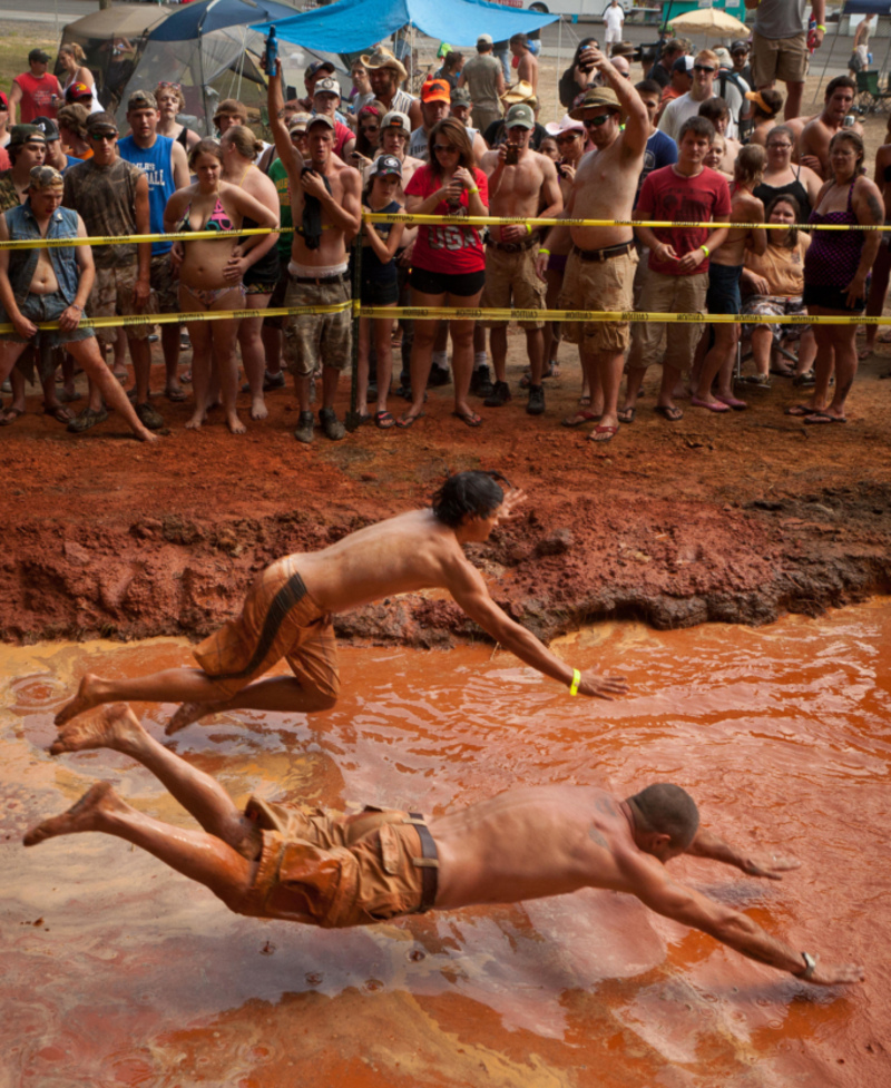 Mud-Pit Belly Flopping | Alamy Stock Photo