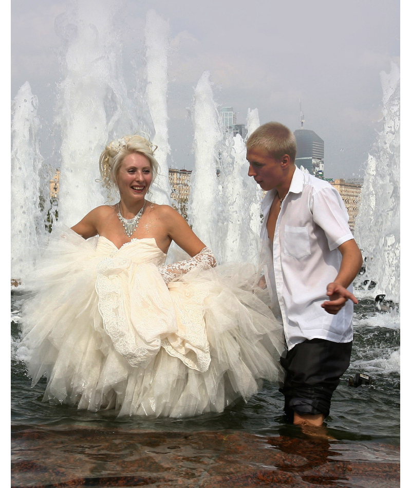 A Wet Wedding | Getty Images Photo by BORIS YELENIN/AFP