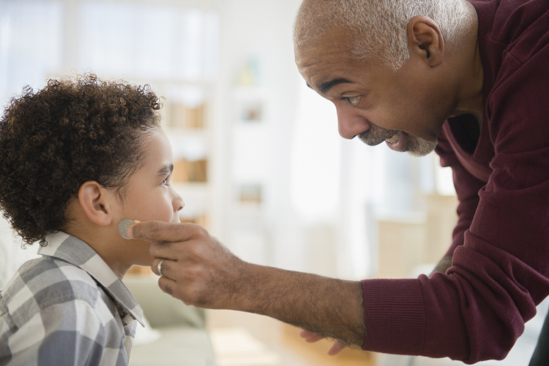 The Coin Behind the Ear Trick | Getty Images Photo by JGI/Jamie Grill