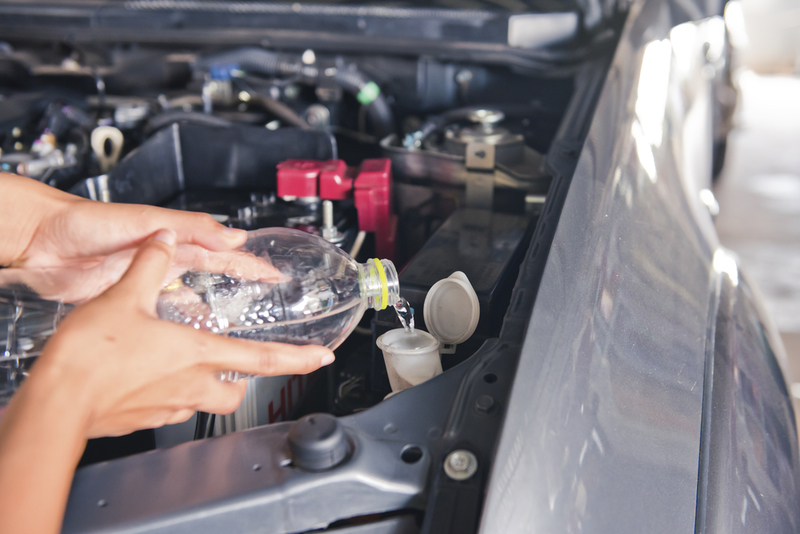 Fill Windshield Wiper Reservoir With Vodka Solution | Shutterstock