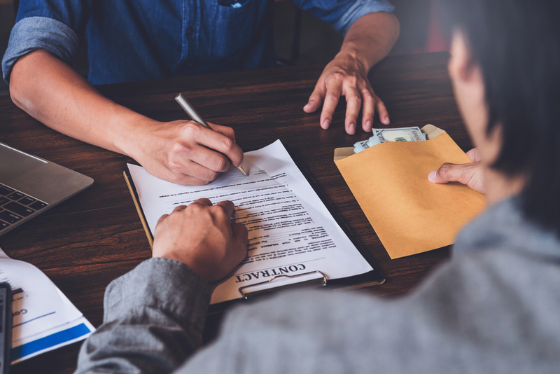 Loan Officers | Jirapong Manustrong/Shutterstock