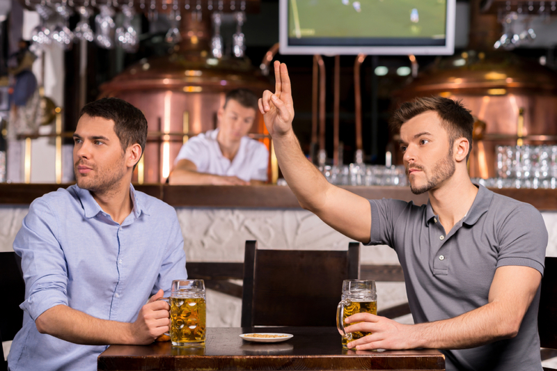 You Try to Make Eye Contact with the Waiter | Shutterstock Photo by G-Stock Studio