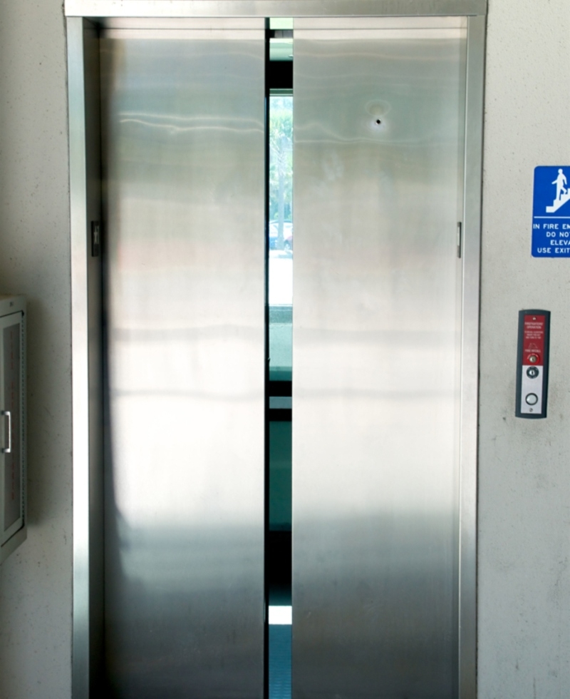 Hole on Elevator Doors | Alamy Stock Photo