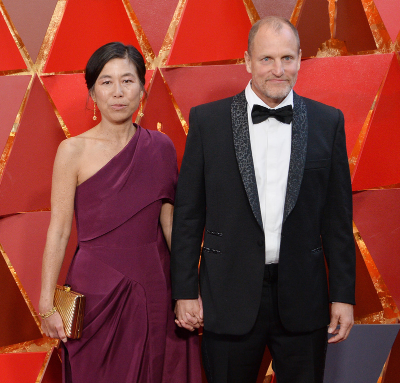 Woody Harrelson and Laura Louie | Alamy Stock Photo by Jim Ruymen/UPI