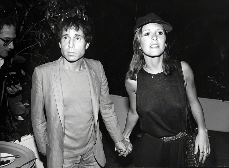 Carrie Fisher y Paul Simon | Getty Images Photo by Robin Platzer/IMAGES