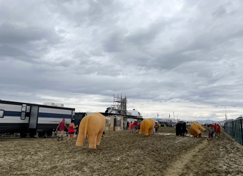 The Wettest Burning Man | Getty Images Photo by Julie JAMMOT / AFP