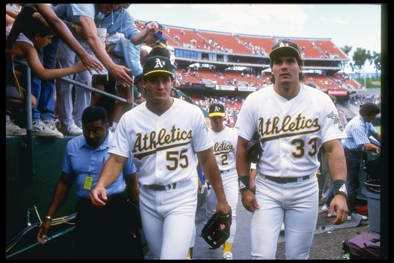 José Canseco e Ozzie Canseco | Getty Images Photo by Otto Greule/Allsport