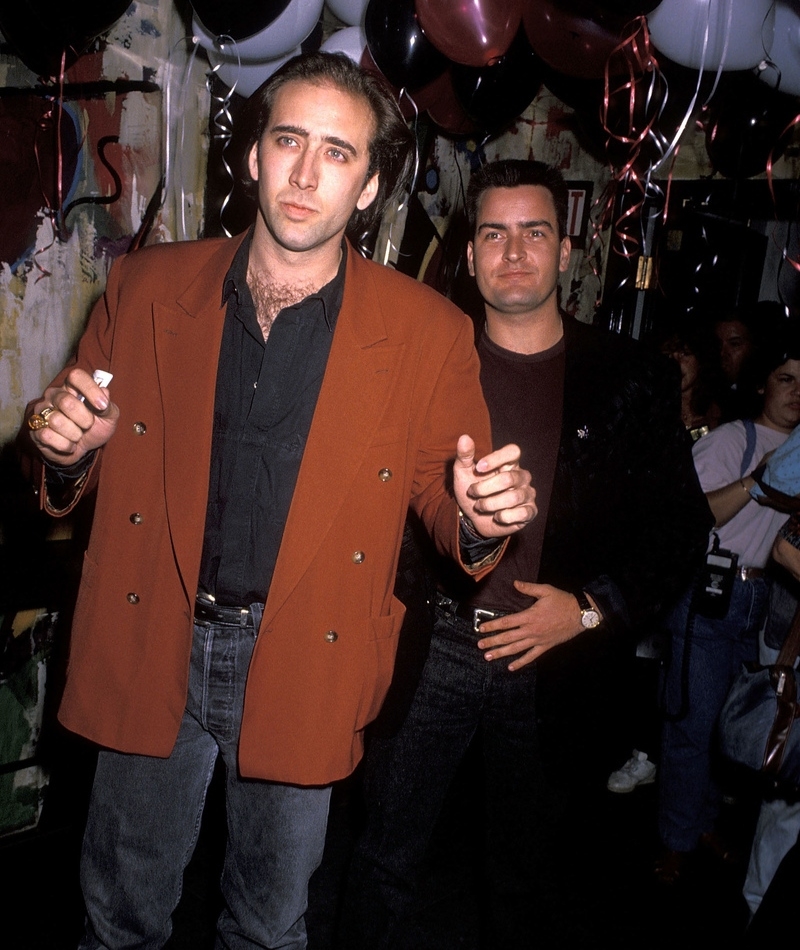 Charlie Sheen and Nic Cage | Getty Images Photo by Ron Galella, Ltd.