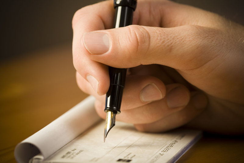 Checkbooks | Alamy Stock Photo by Mike Kemp/RubberBall