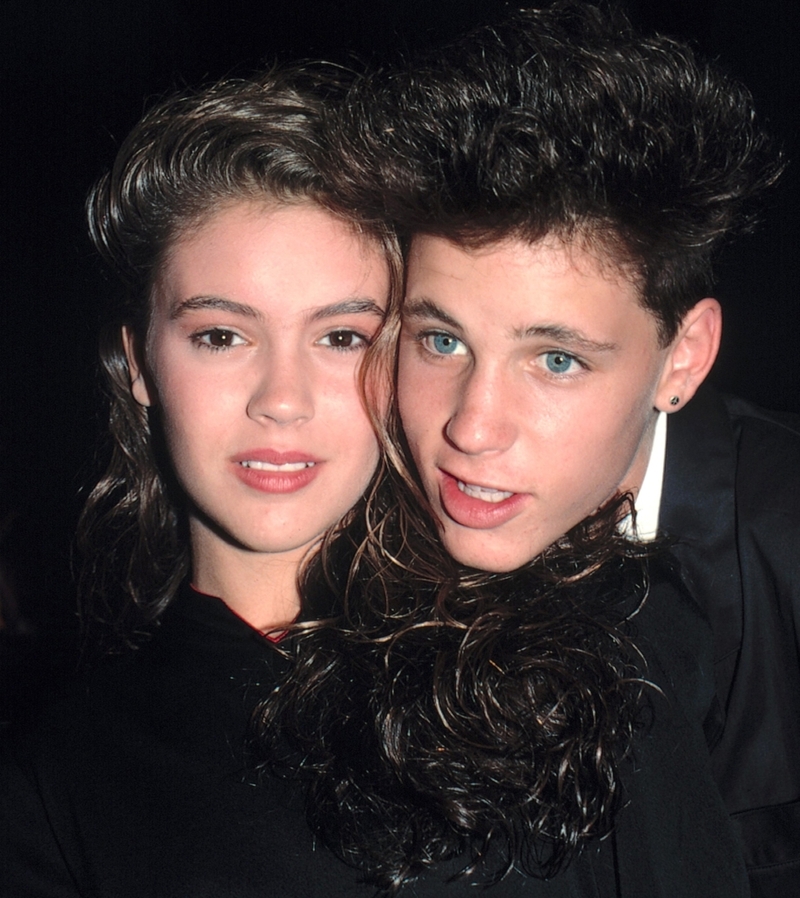 Alyssa Milano e Corey Haim | Getty Images Photo by Walter McBride/Corbis