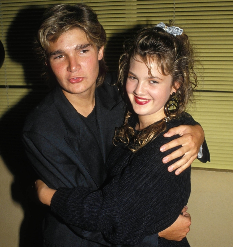 Corey Feldman e Drew Barrymore | Alamy Stock Photo