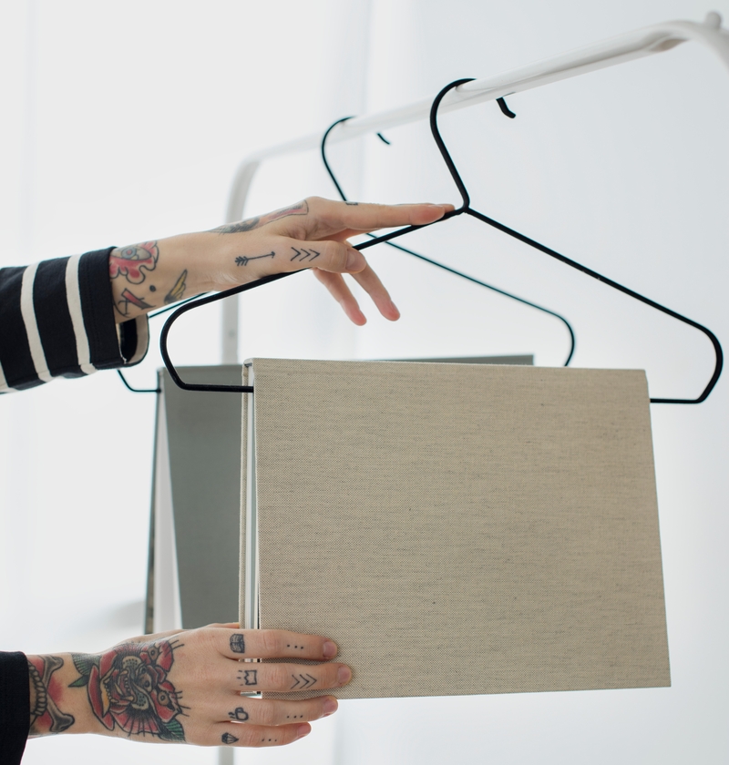 Repurpose Clothes Hangers as Book Racks | Adobe Stock Photo by rawpixel.com