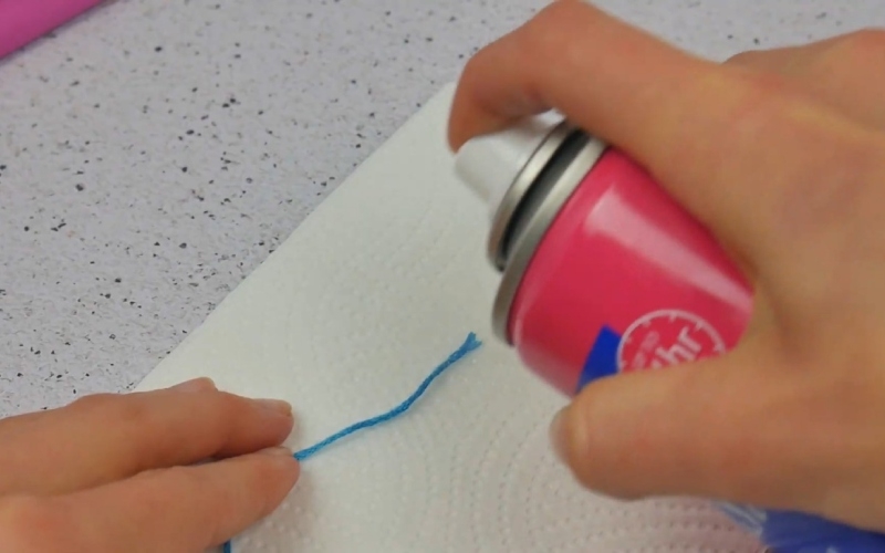 Set Unruly Threads With Hairspray | Youtube.com/Craftsy Hacks