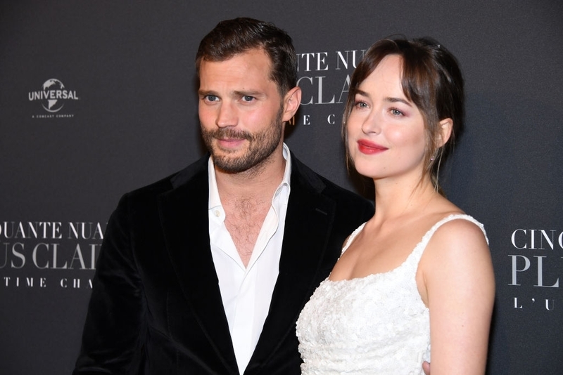 Dakota Johnson  vs. Jamie Dornan | Getty Images Photo by Pascal Le Segretain